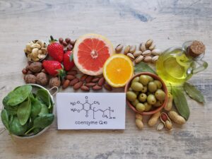 Foods with Coenzyme Q10. Natural food sources rich in CoQ10 include: berries, nuts, citrus fruit, spinach. Coenzyme Q10 is vital for energy production in cells. Chemical formula of Coenzyme Q1O, CoQ10