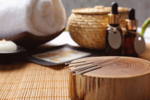 Composition with acupuncture needles on bamboo mat in Seattle WA