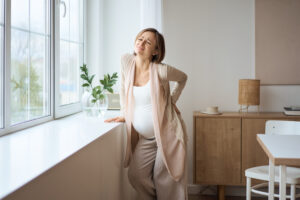 pregnancy Woman with back pain in pregnancy standing